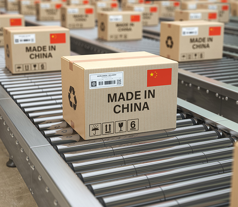 Made in China. Cardboard boxes with text made in China and chinese flag on the roller conveyor. 3d illustration