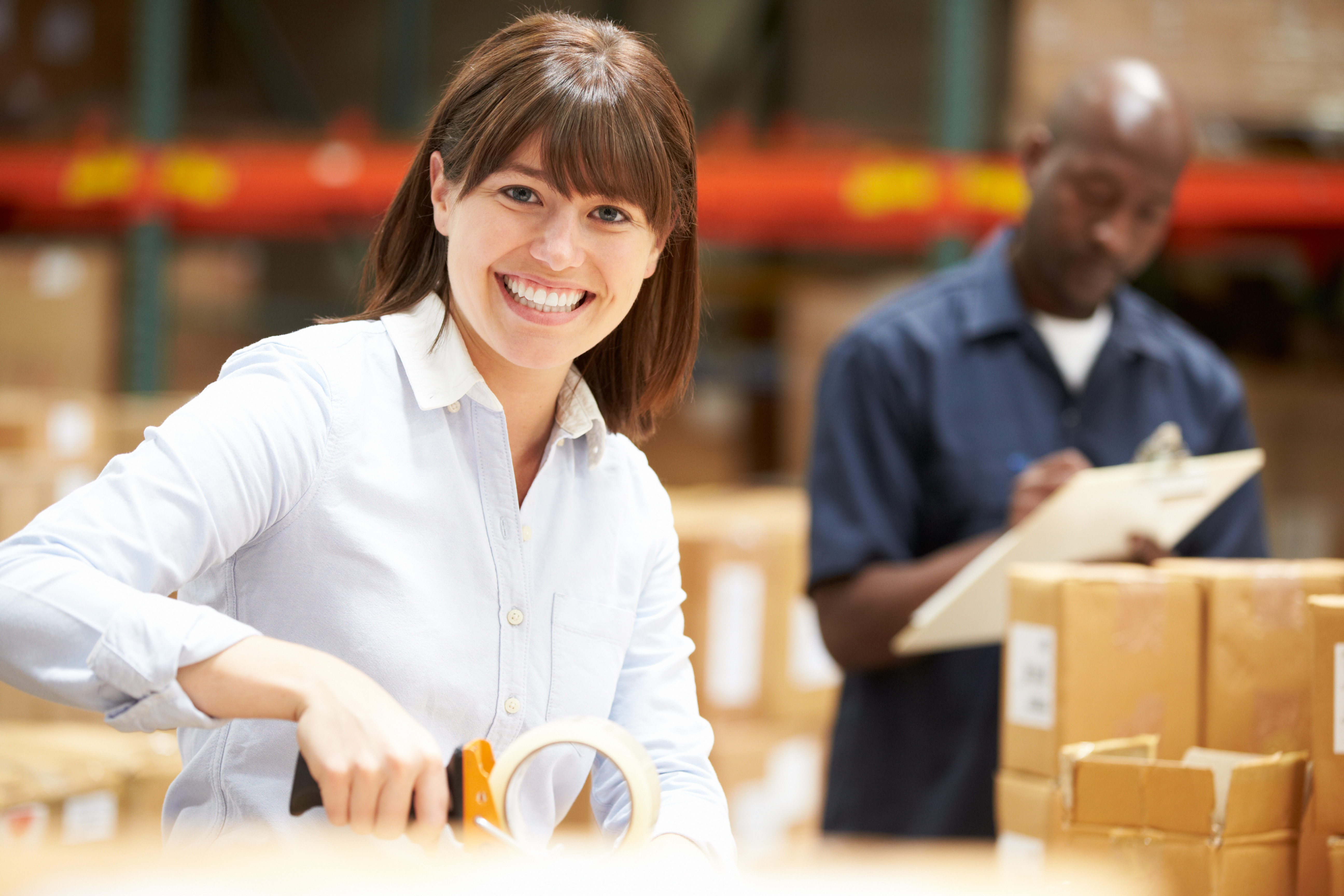 Workers In Warehouse Preparing Goods For Dispatch